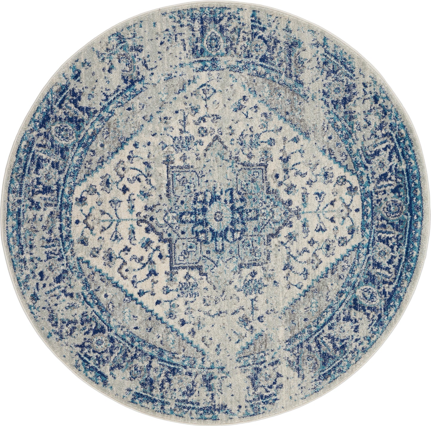 Round distressed blue and ivory medallion rug; vintage oriental style, soft woven texture.