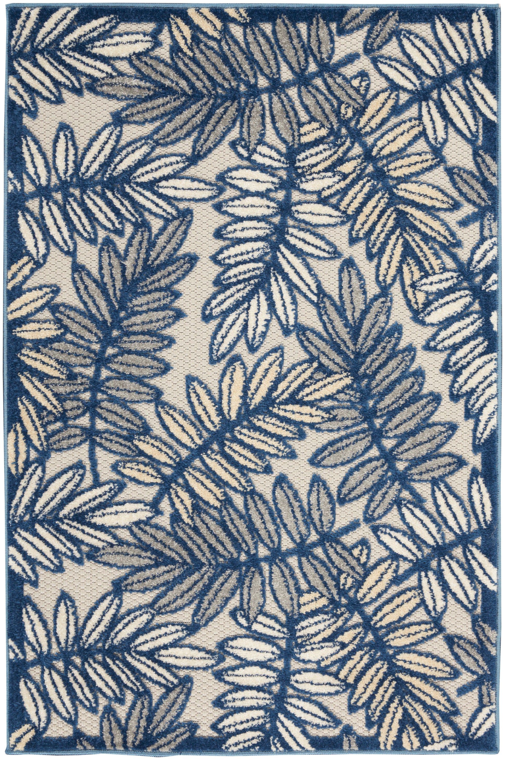 Rectangular rug featuring cream base with deep blue fern pattern and matching blue border.