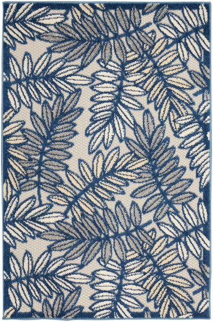 Rectangular rug featuring cream base with deep blue fern pattern and matching blue border.