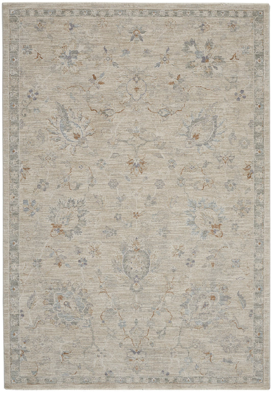 Muted beige oriental rug with pale blue and gray floral motifs, rust accents and a decorative border.