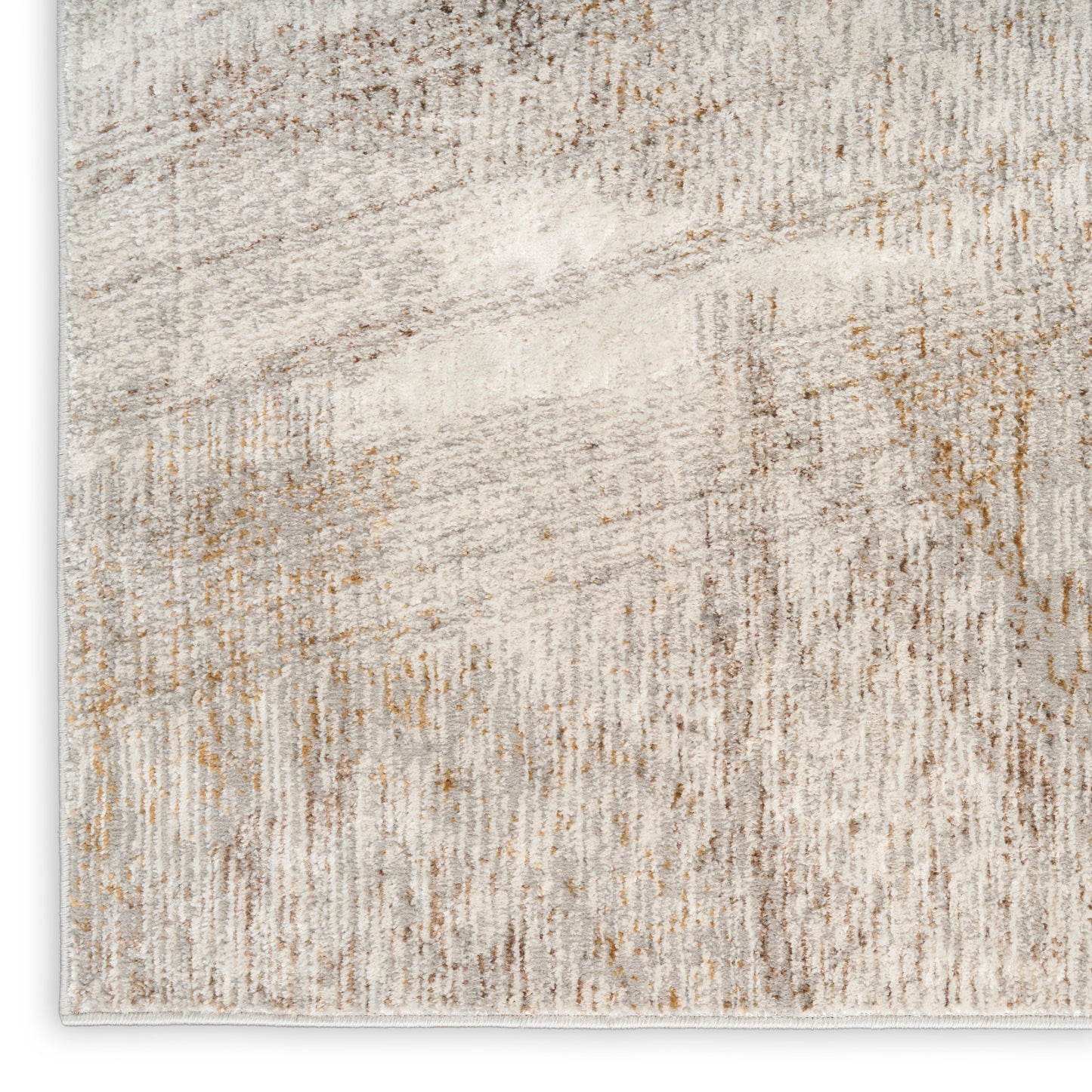 Abstract beige cream area rug with taupe and light brown distressed pattern, soft pile.