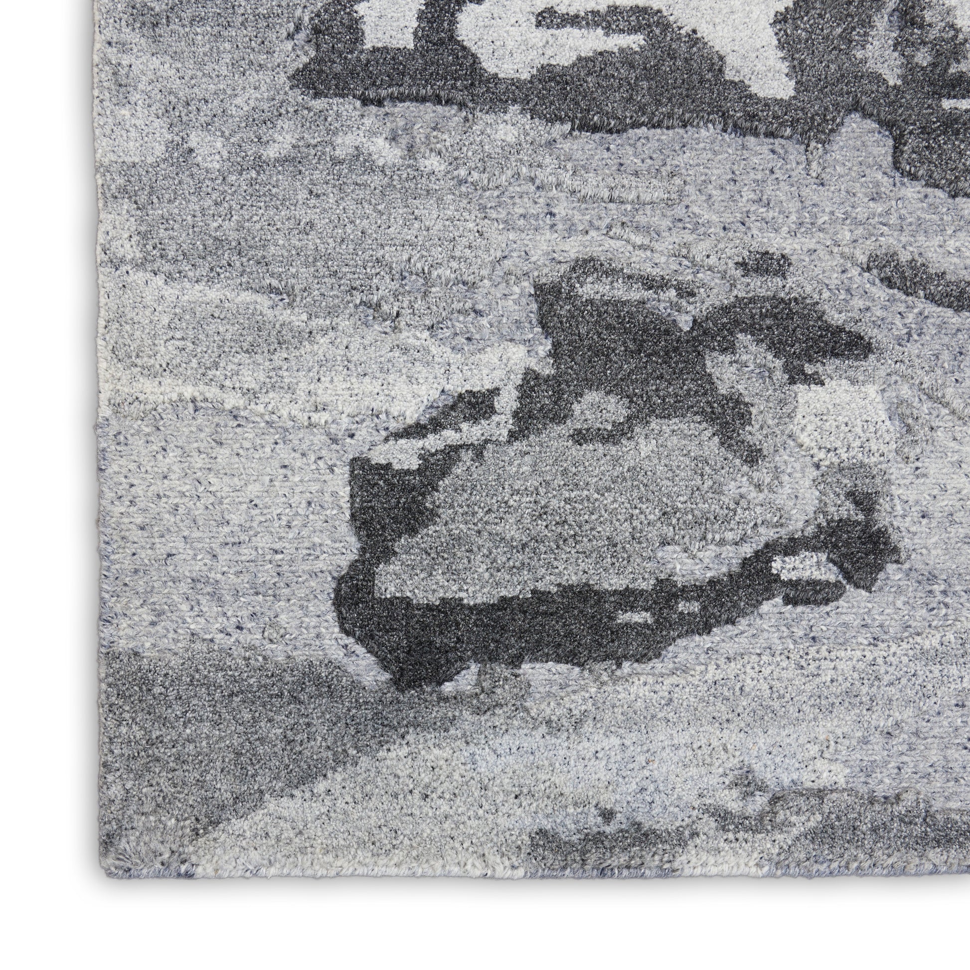 Gray abstract-pattern rug with charcoal & light gray tones; plush high-pile, rectangular, modern living room style.