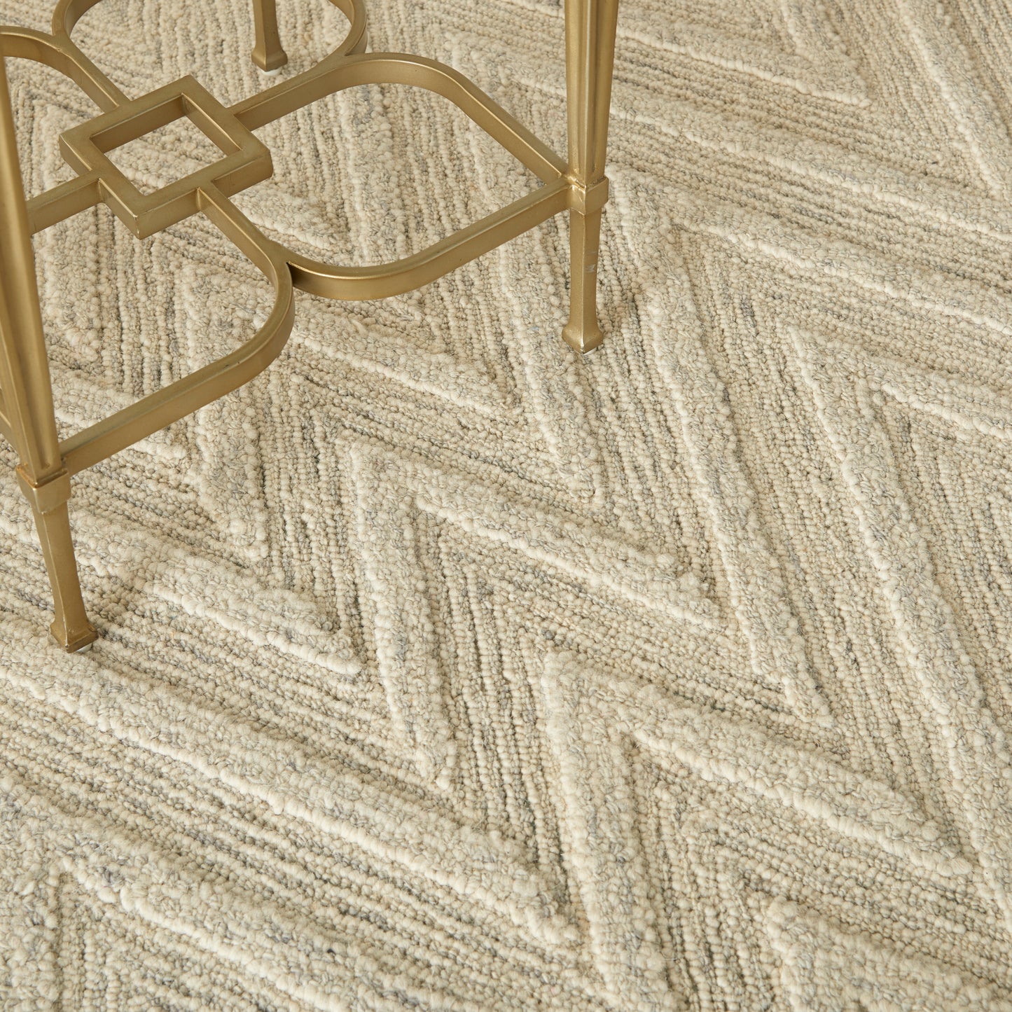 Beige chevron-patterned rug, modern style, 5' x 8'.