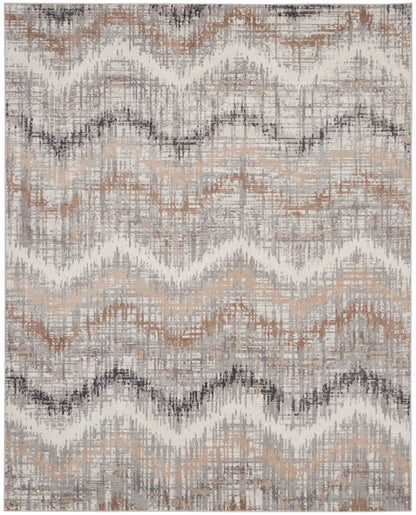 Distressed zigzag patterned area rug in beige, gray, taupe and rust tones with a woven texture.