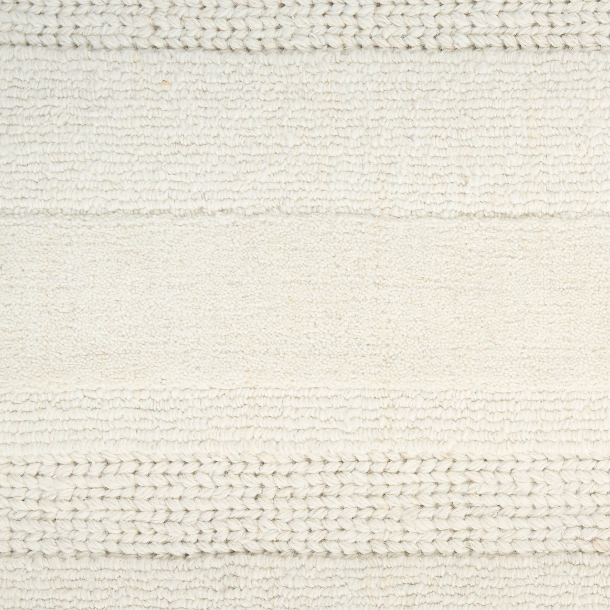 Cream textured woven rug with alternating knitted and looped stripes; soft, neutral bath mat.