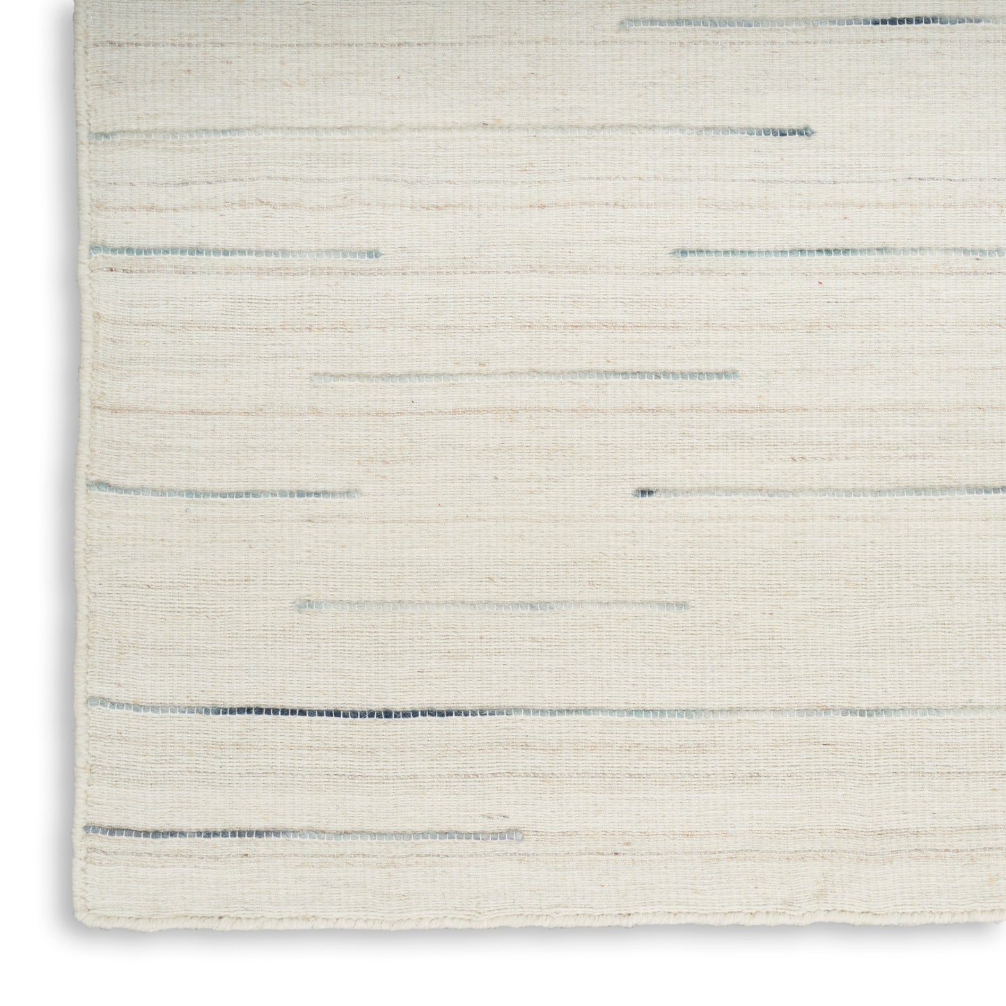 Cream flatwoven rug with pale blue horizontal streaks and soft textured weave.