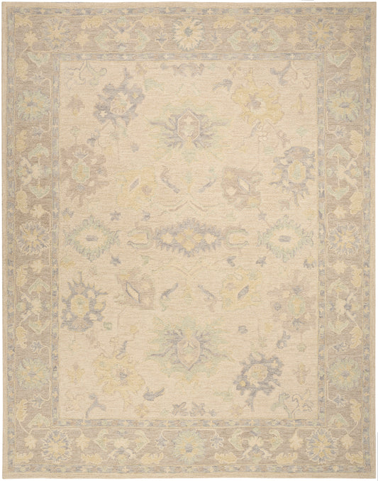 Pastel-toned vintage rug with cream field and soft blue, yellow, and mint floral motifs; lavender border.