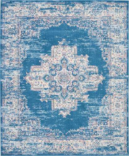 Rectangular blue and ivory distressed Persian-inspired rug with central medallion and ornate border.