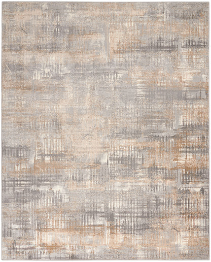Abstract gray and beige rug with a textured patchwork grid and distressed finish.