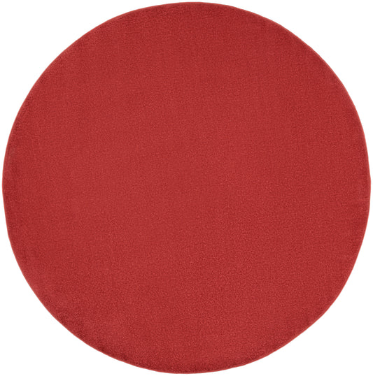 Red circular makeup sponge pad with soft velvety texture for powder/blush application.