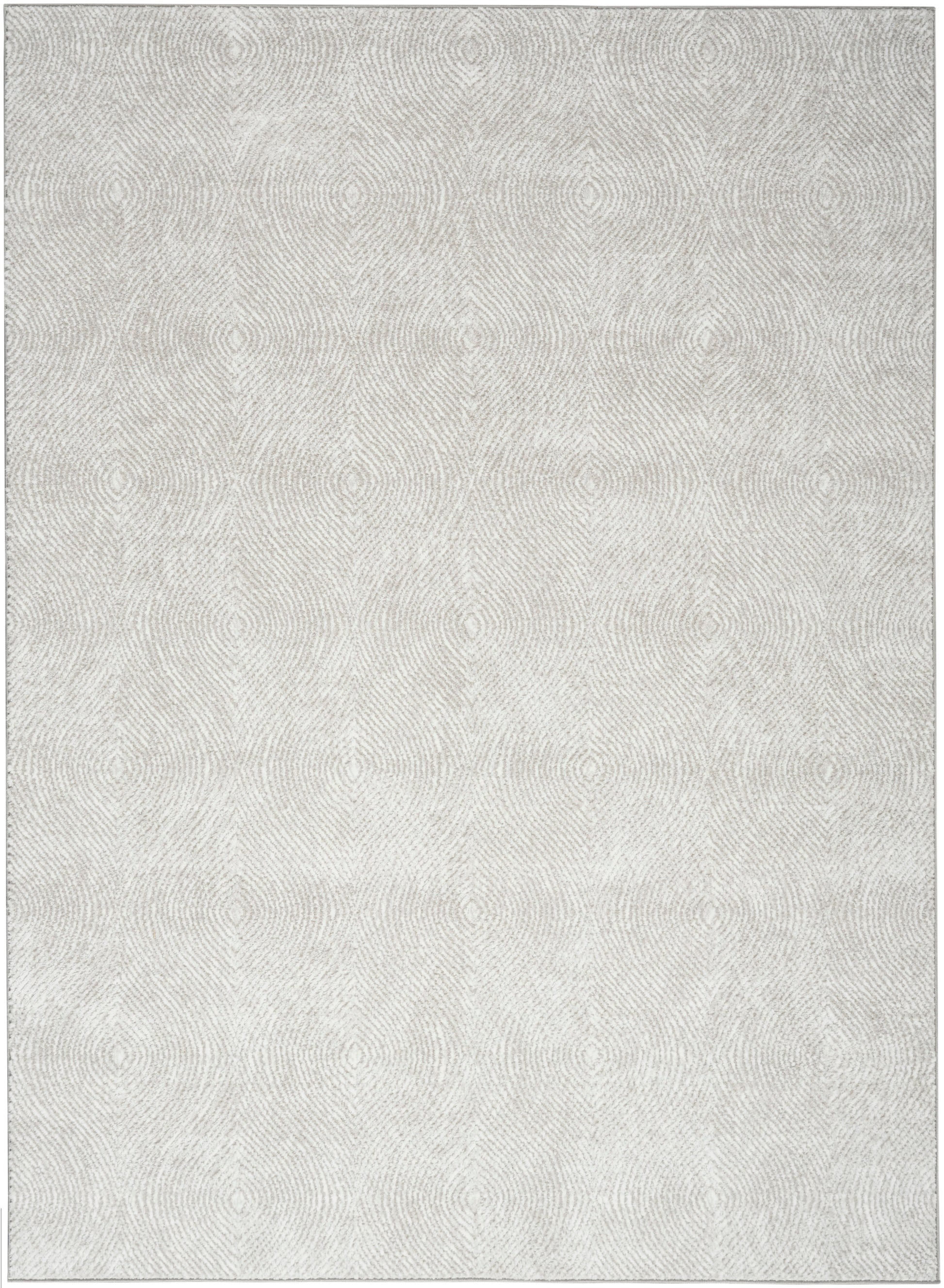 Light gray rug with a soft, embossed concentric circle pattern; neutral, modern home decor.