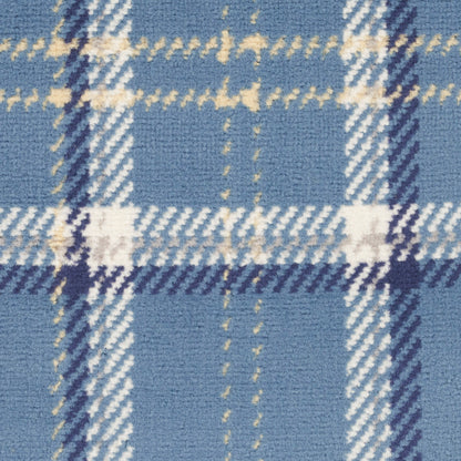 Blue plaid rug with white and beige lines, wool texture, tartan style.