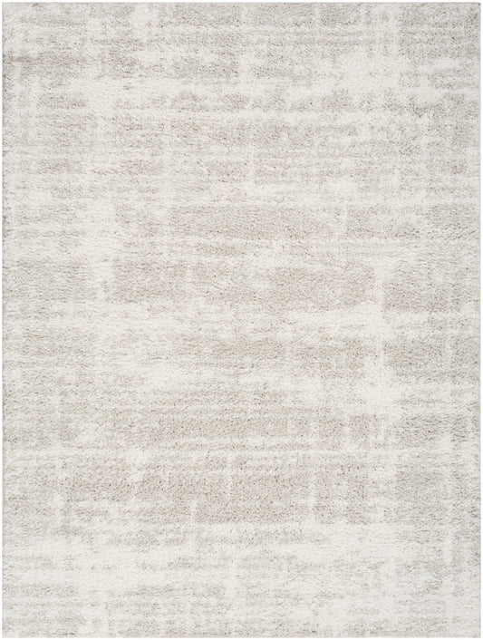 Light cream and beige area rug with a subtle mottled pattern and plush, soft texture.