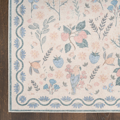 Pastel floral rug with blue wavy border, pink and blue blossoms, and a small blue bird motif on a light beige background.