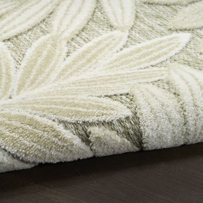 Cream shag rug with raised leaf motif, plush tufted texture for modern home decor.