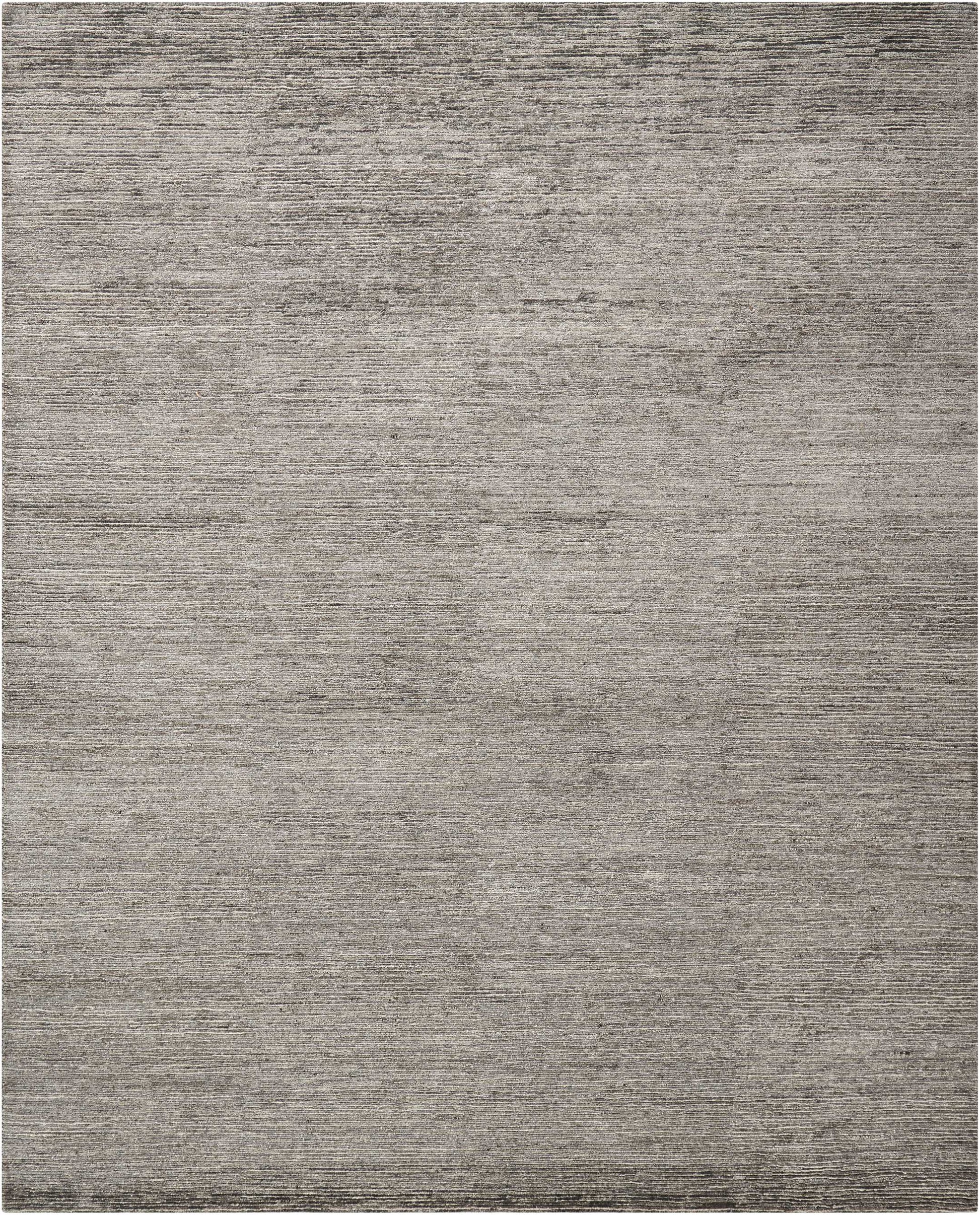 Gray textured rectangular rug with subtle horizontal striations; modern, versatile for living room or bedroom.