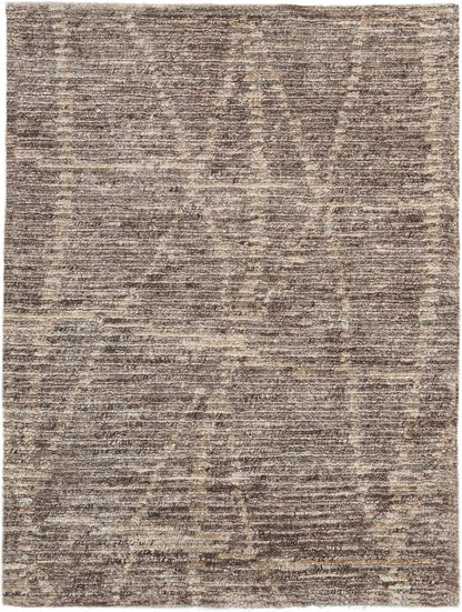 Rectangular brown and beige distressed-pattern rug with vintage-inspired motifs; versatile for living spaces.