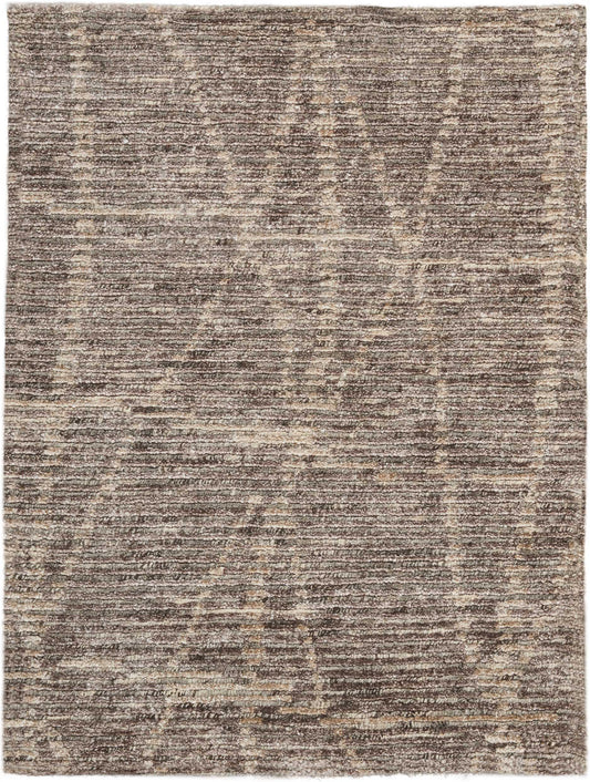 Rectangular brown and beige distressed-pattern rug with vintage-inspired motifs; versatile for living spaces.