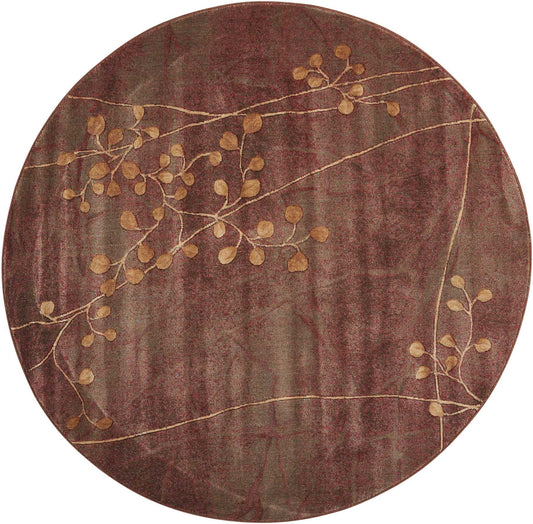 Round burgundy rug with gold botanical branches and leaves across the circle.