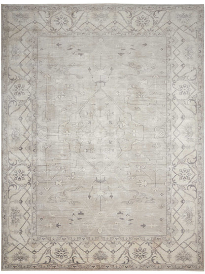 Muted gray-beige oriental rug with a subtle central medallion and ornate floral border.