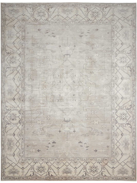 Muted gray-beige oriental rug with a subtle central medallion and ornate floral border.