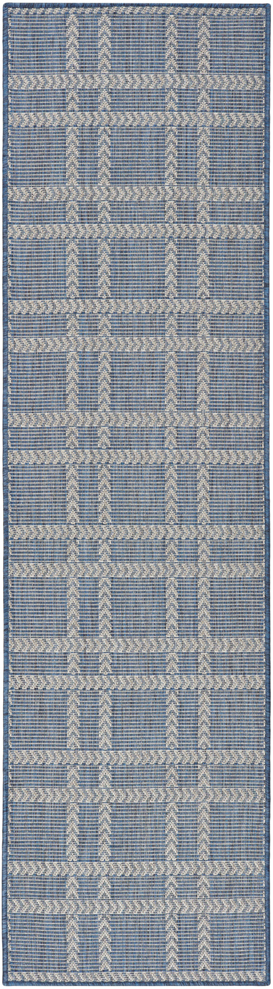 Blue and cream woven runner rug with geometric chevron columns and horizontal lattice bands.