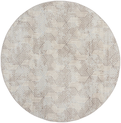 Round rug in beige, taupe and gray with interlocking striped hexagon pattern; softly textured, contemporary decor