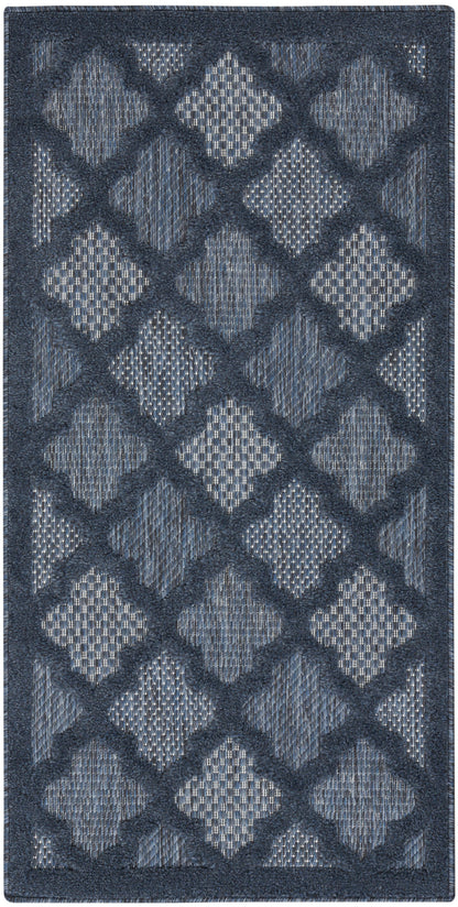 Rectangular navy-blue rug with raised diamond lattice pattern in light blue, plush woven texture for modern living spaces.