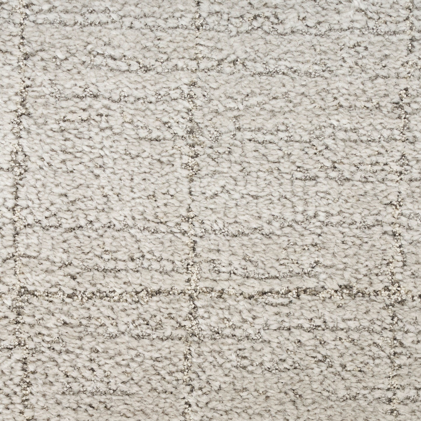 Cream shag rug with plush boucle texture and subtle square-grid pattern in beige tones.