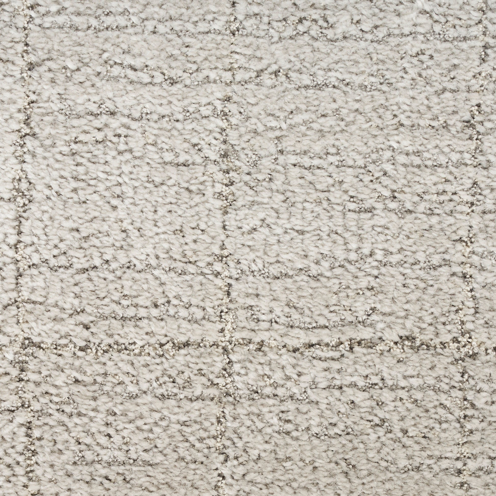 Cream shag rug with plush boucle texture and subtle square-grid pattern in beige tones.