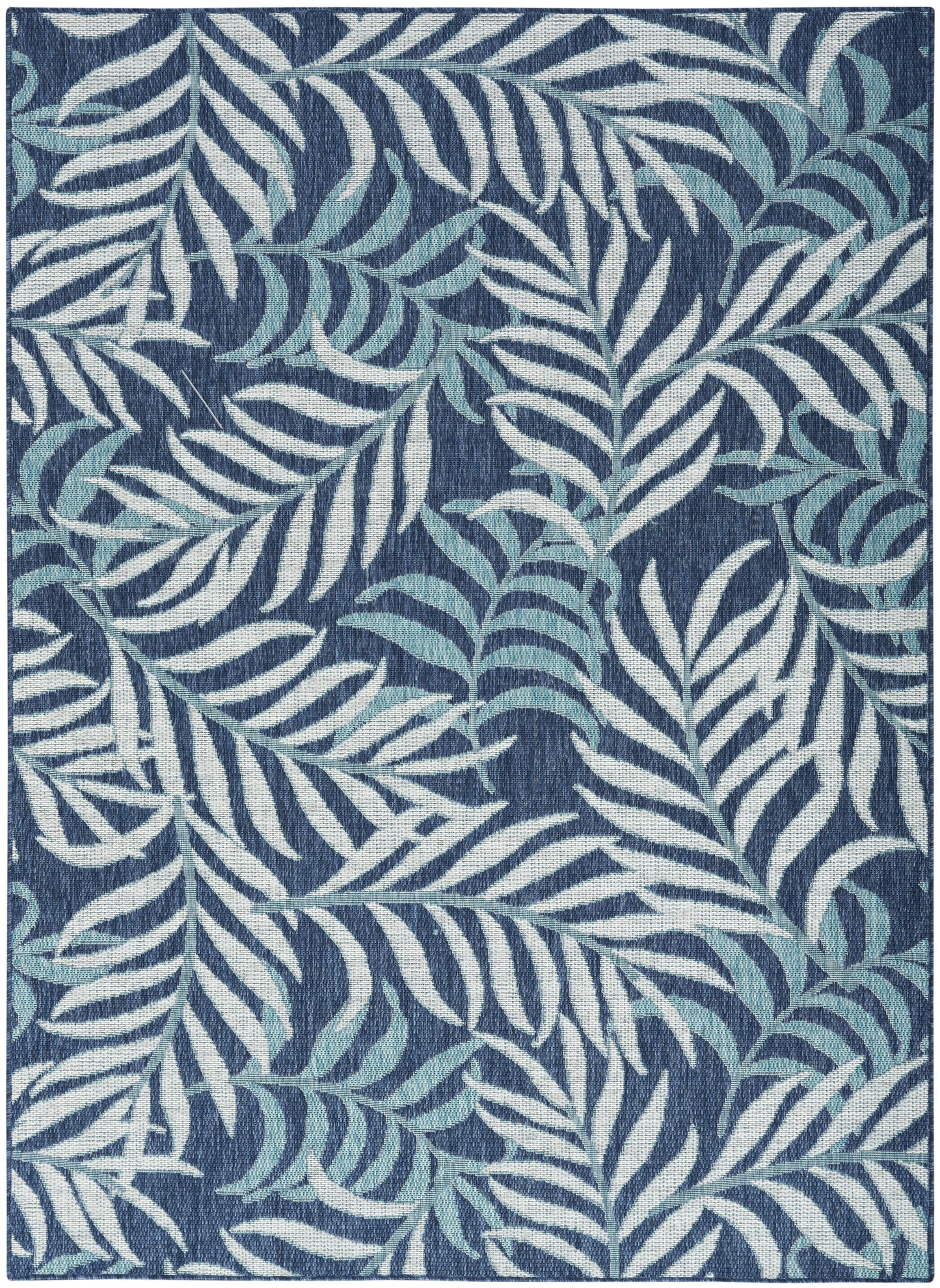 Rectangular navy rug with white and light-blue palm leaf pattern; woven textile, tropical botanical style.