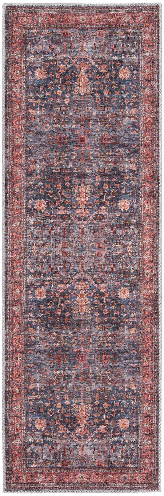 Persian-style runner rug in blue and red with intricate floral motifs and fringed ends.