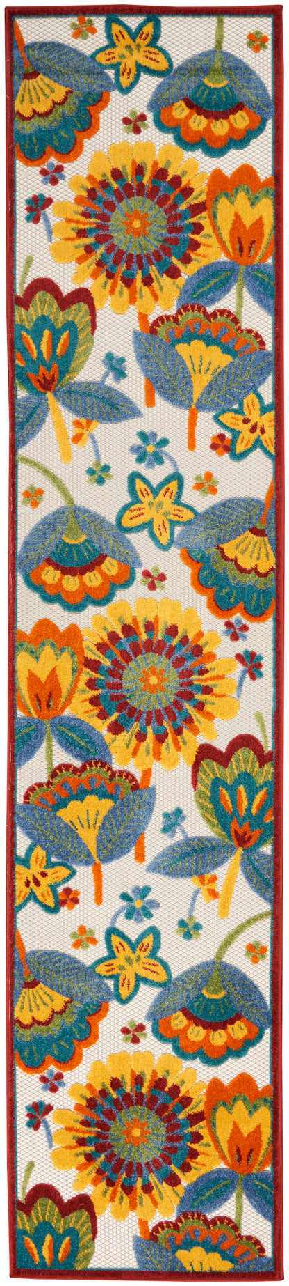 Vibrant floral rug runner with large yellow and orange blooms, teal accents, green leaves on white, red border.