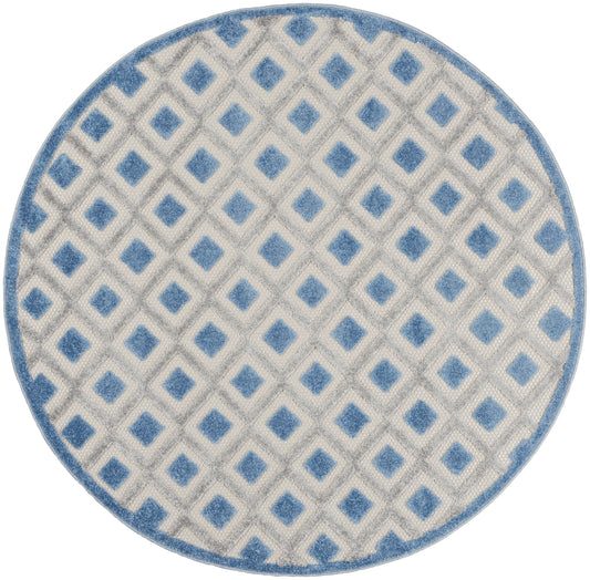 Round rug with blue border, off-white field, and repeating blue diamond lattice pattern; modern geometric style.