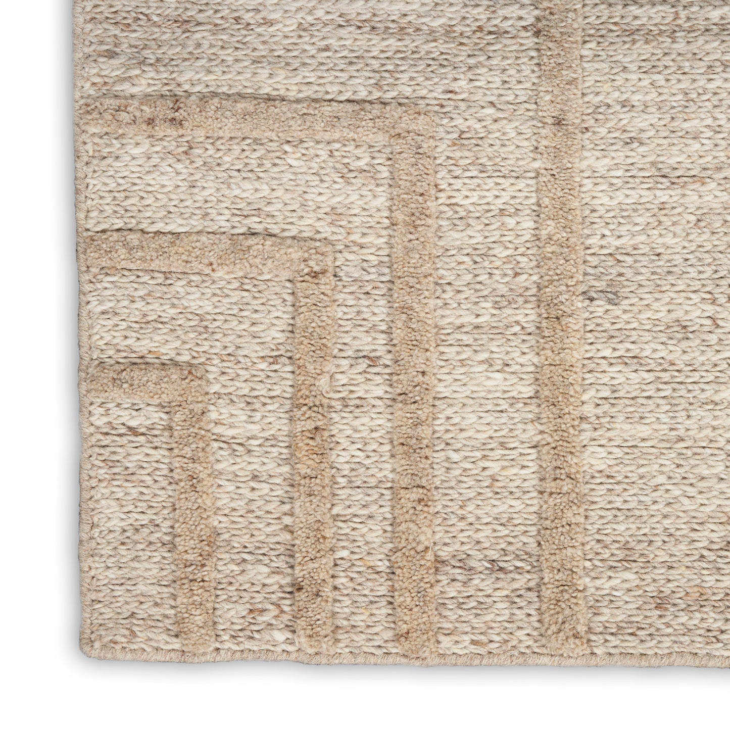 Beige woven jute rug with textured surface and geometric stepped border for modern, neutral interiors.