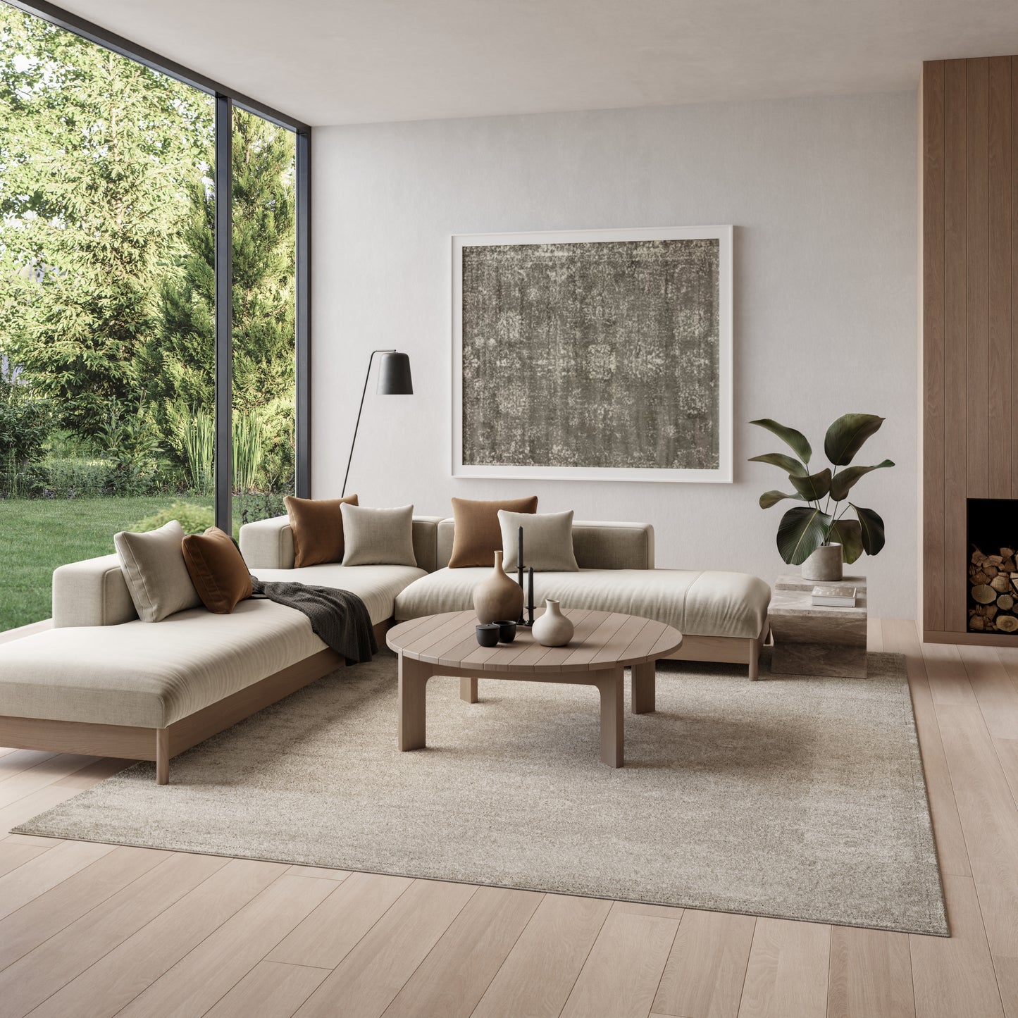 Neutral living room with beige rug (8' x 10'), round wood coffee table, large abstract art, and a floor lamp by tall windows.