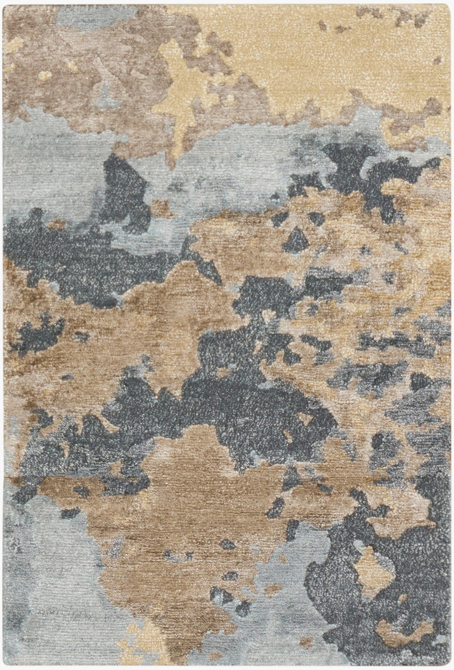 Abstract area rug with beige, tan, blue-gray and charcoal patches in a modern camouflage pattern.