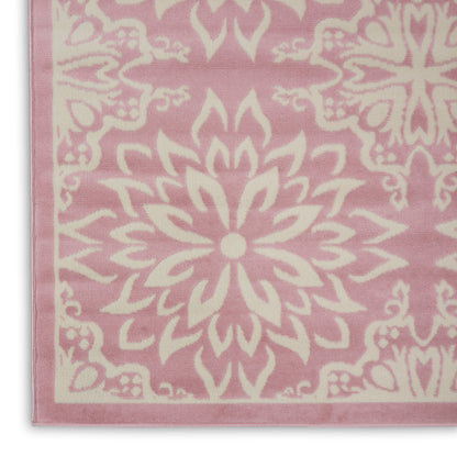 Pink bath towel with white mandala floral pattern and pale pink border; soft cotton terry.