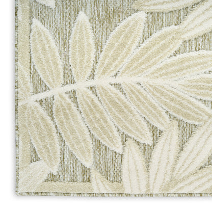 Cream textured rug with embossed palm-leaf pattern and light border, woven in beige fibers.