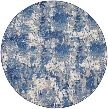Round area rug with abstract blue, white and beige pattern; modern, painterly texture.
