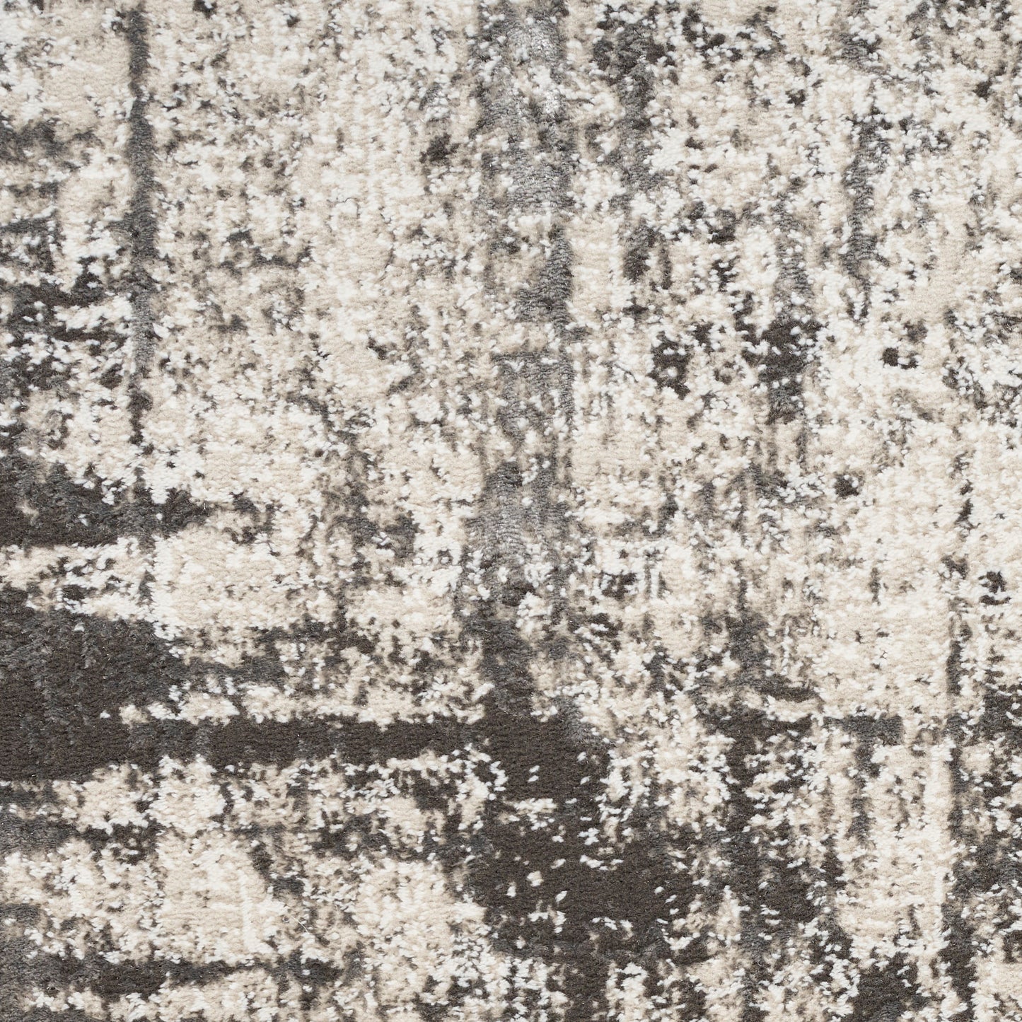 Beige and dark brown abstract distressed rug texture with a mottled pattern, woven area rug.