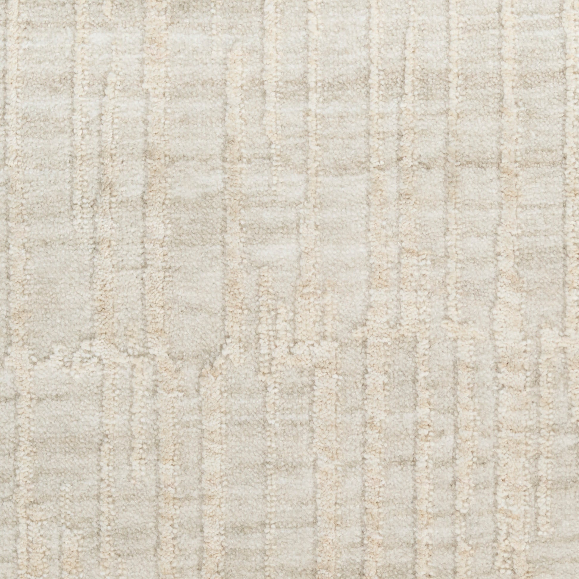 Beige textured rug with a soft cream and taupe linear pattern and plush weave.