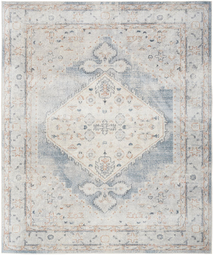 Distressed vintage-style area rug in blue and beige, featuring a central diamond medallion and ornate floral border.