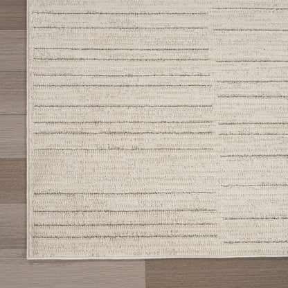 Beige textured flatweave runner rug with cream & taupe horizontal stripes on wood floor.