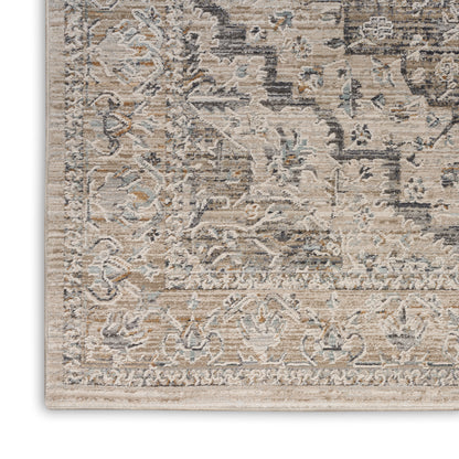 Beige and gray distressed oriental rug with pale blue and rust accents, featuring floral medallion pattern and border.