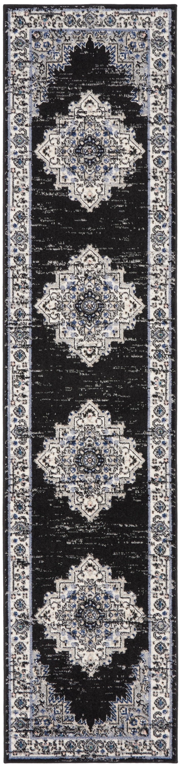 Narrow black Persian-style runner rug with ivory and blue medallions and an intricate floral border.