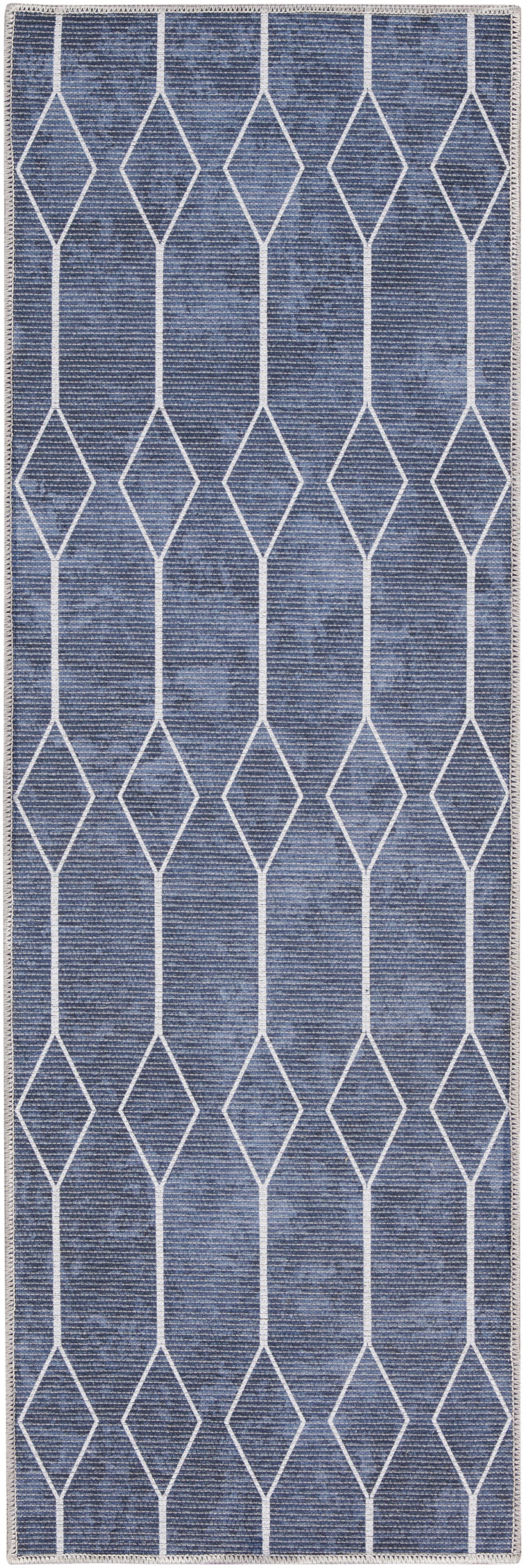 Blue denim-style runner rug with white diamond lattice pattern and fringe edges.