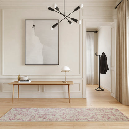 Neutral minimalist entryway with beige paneled walls, wooden console, abstract art, modern chandelier, pink runner rug.