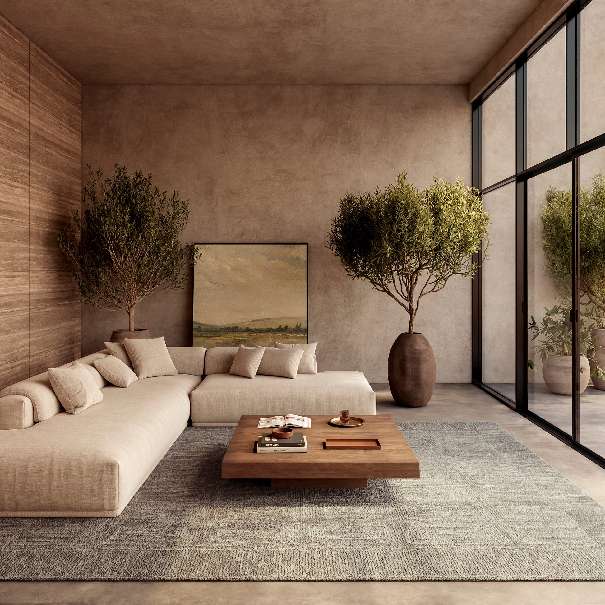 Beige modular sofa with cushions in a warm, contemporary living room; wooden coffee table, rug, potted trees, and glass wall.