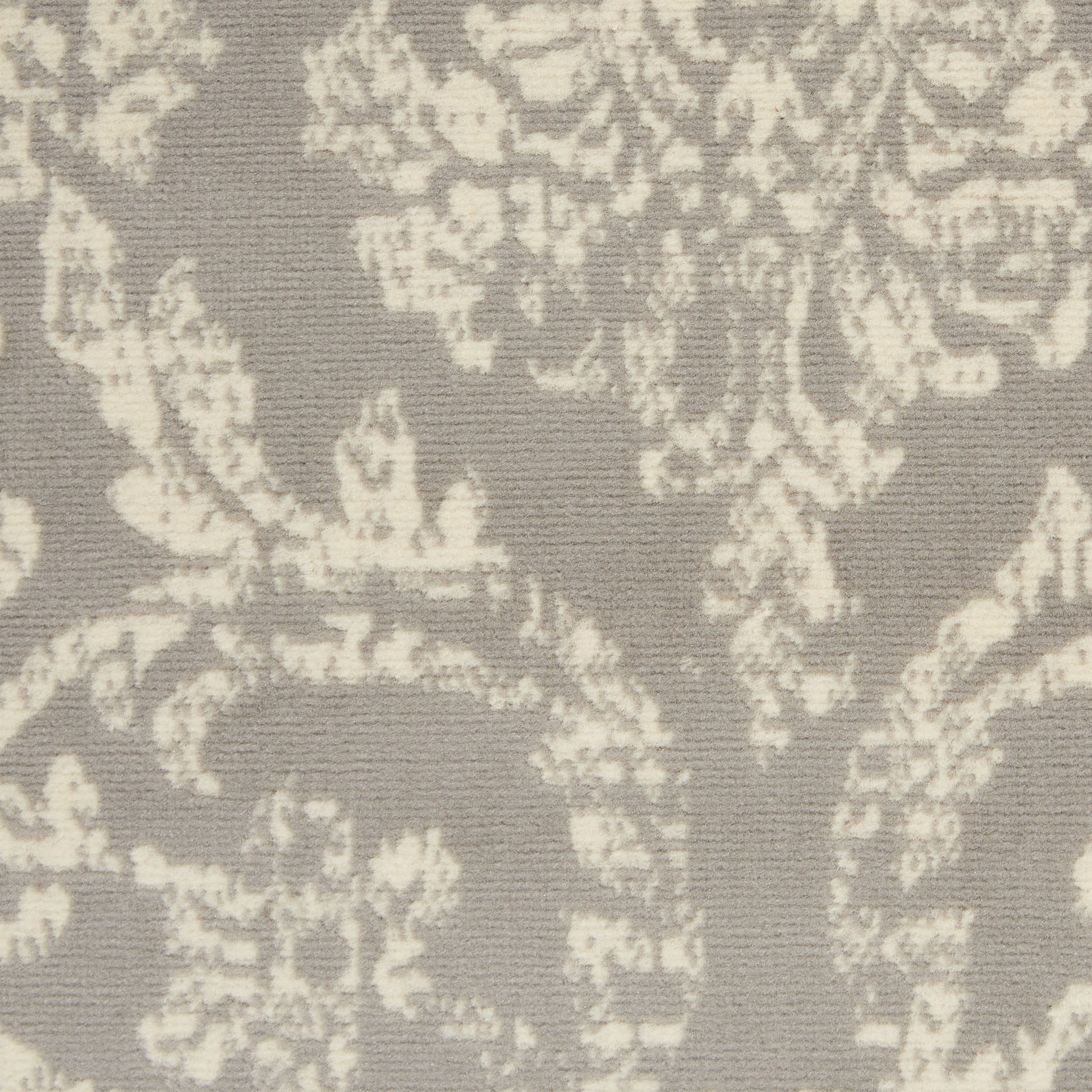 Taupe damask rug with ivory floral pattern; woven texture; vintage style.